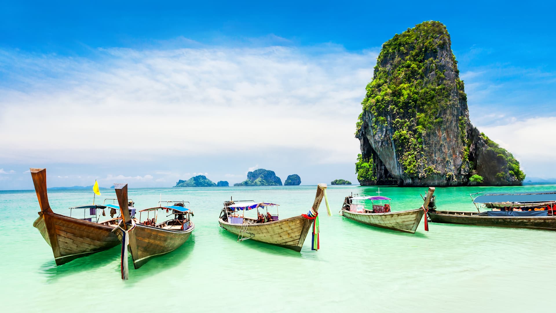 Visit the beautiful beaches of Thailand, where you can swim with the pigs at "Piggy Island".