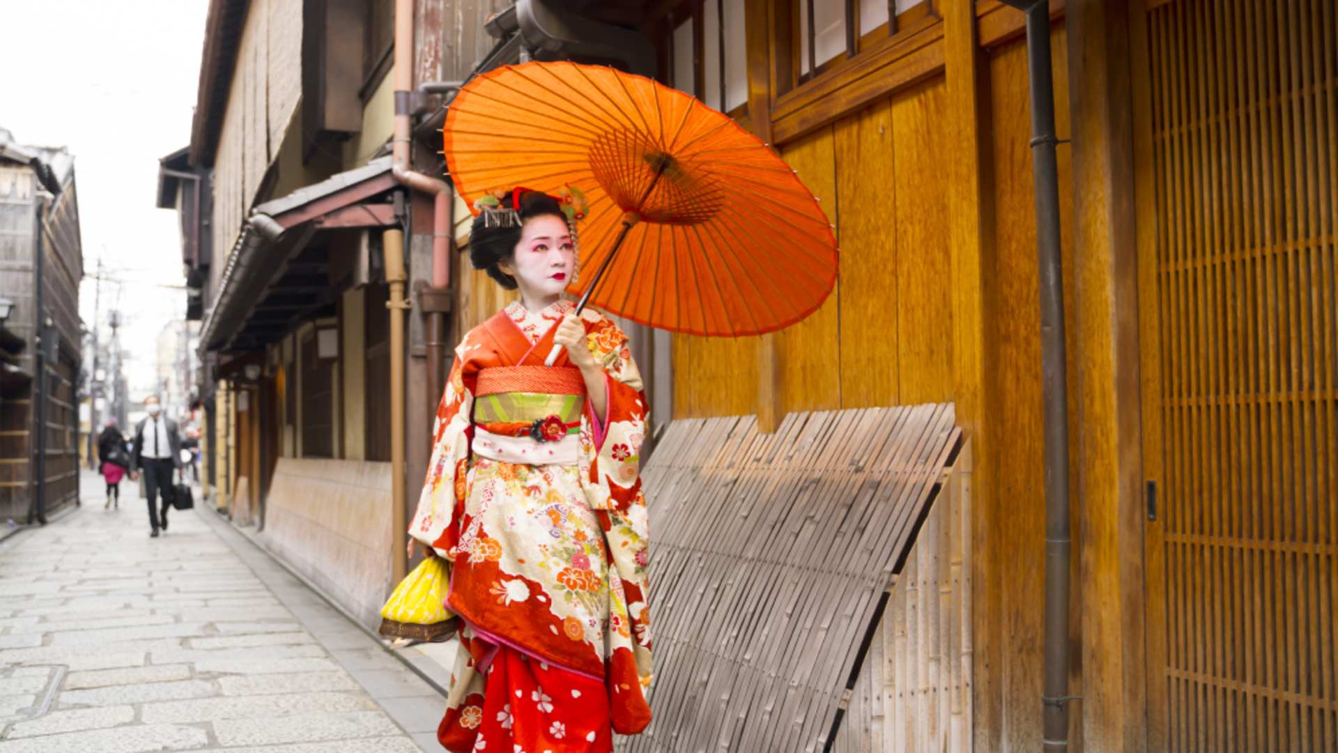 Catch a glimpse of a geisha slipping through Kyoto's old streets.