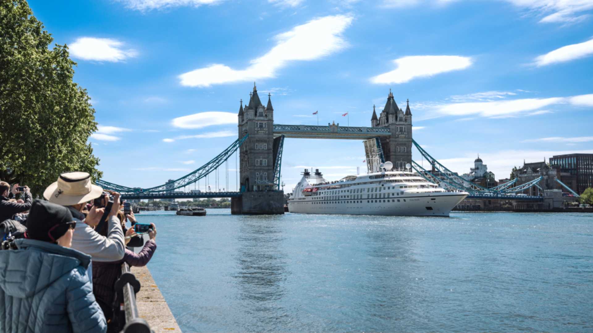 Sail beneath London's iconic Tower Bridge to dock in the heart of the city.