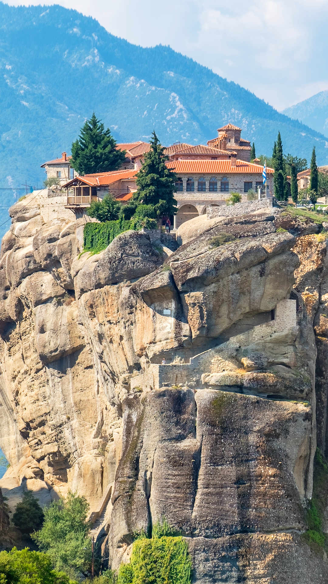 An Eastern Orthodox Monastery sits atop the natural rock pillar Meteora in Greece 