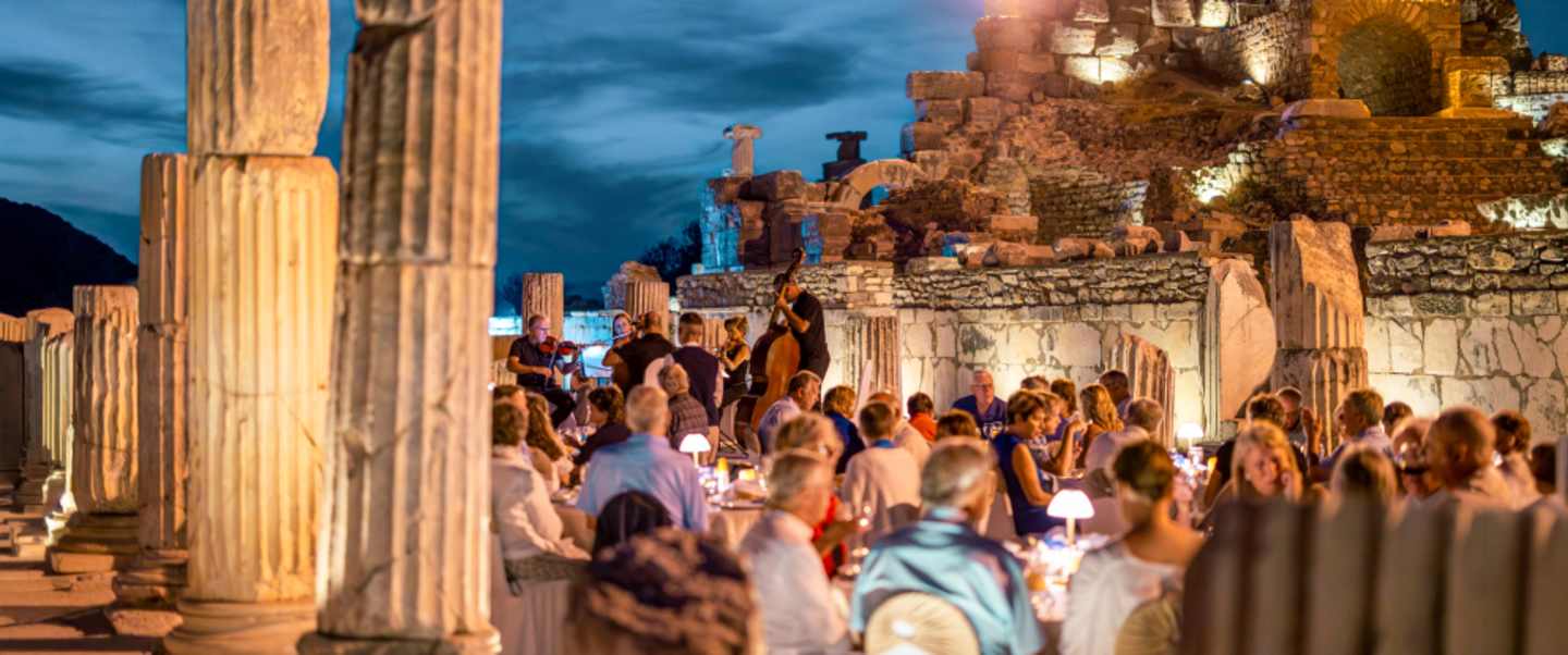 Dinner among the ruins under the stars, with live chamber music against 2,000 years of stone. 