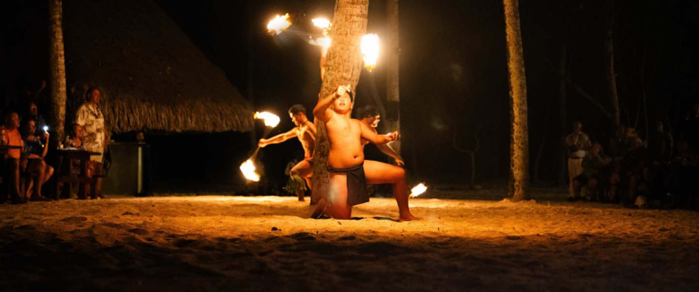A Polynesian feast on a private motu, followed by fire-spinning as night falls over the lagoon. 