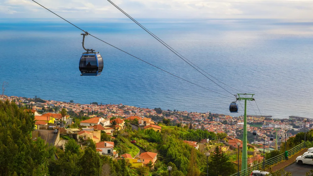 Ride Funchal's cable car up to Monte, then descend by wicker toboggan steered along Madeira's cobblestone streets.